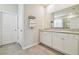 Bathroom with double sink vanity and granite countertop at 32231 Conchshell Sail St, Wesley Chapel, FL 33545
