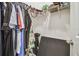 Organized closet with wire shelving and hanging clothes offers efficient storage space at 32231 Conchshell Sail St, Wesley Chapel, FL 33545