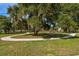 Inviting community park with walking paths, playground, mature trees and plenty of green space at 32231 Conchshell Sail St, Wesley Chapel, FL 33545