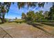 Well-maintained community dog park with shade trees, benches, and a fenced perimeter for secure recreation at 32231 Conchshell Sail St, Wesley Chapel, FL 33545