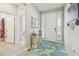 Welcoming entryway featuring a decorative table and a view into other rooms at 32231 Conchshell Sail St, Wesley Chapel, FL 33545