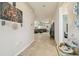 Entrance hallway with decorative accents leading to a living area with furniture at 32231 Conchshell Sail St, Wesley Chapel, FL 33545