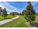 Beautifully landscaped front yard and long driveway leading up to a house with elegant curb appeal at 32231 Conchshell Sail St, Wesley Chapel, FL 33545