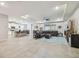 Open-concept living space with access to the kitchen and outdoor area at 32231 Conchshell Sail St, Wesley Chapel, FL 33545