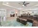 Expansive living area with desk, living room seating, and open access to the kitchen at 32231 Conchshell Sail St, Wesley Chapel, FL 33545
