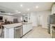 Open-concept living area with a seamless flow between the kitchen, dining, and living spaces at 32231 Conchshell Sail St, Wesley Chapel, FL 33545