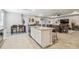 Open-concept layout seamlessly connecting the kitchen, dining, and living area, great for gatherings at 32231 Conchshell Sail St, Wesley Chapel, FL 33545