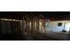 A look at the interior of a home which has exposed studs and visible ceiling rafters at 3308 E Frierson Ave, Tampa, FL 33610