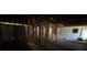 Dilapidated interior showcases unfinished walls, exposed framing, and debris scattered around at 3308 E Frierson Ave, Tampa, FL 33610