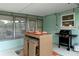Back patio featuring dining and barbecue area with easy access to home at 341 Wertz Dr, Largo, FL 33771