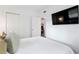 Bedroom featuring closet, flatscreen TV, view of dining area through door at 341 Wertz Dr, Largo, FL 33771
