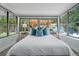 Sunroom bedroom featuring windows looking out to a pergola at 341 Wertz Dr, Largo, FL 33771
