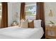 Well-lit bedroom featuring windows with brown curtains, and textured wallpaper at 341 Wertz Dr, Largo, FL 33771