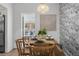 Charming dining area showcasing a beautifully arranged table setting and serene bedroom views, perfect for enjoying intimate meals at 341 Wertz Dr, Largo, FL 33771