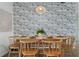 Elegant dining room featuring a wooden table set for a meal, surrounded by comfortable chairs and stylish decor for gatherings at 341 Wertz Dr, Largo, FL 33771