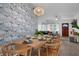 Well-decorated dining area with elegant wallpaper, a stylish pendant light, and a neatly set table for memorable meals at 341 Wertz Dr, Largo, FL 33771