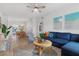 Bright living room with stylish decor, featuring a cozy seating area and cohesive design elements, perfect for relaxation at 341 Wertz Dr, Largo, FL 33771