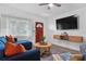 Comfortable living area with a large TV, featuring a cozy seating arrangement, and modern entertainment setup for relaxation at 341 Wertz Dr, Largo, FL 33771