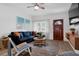 Inviting living room with a comfortable sofa, a large window offering natural light, and a welcoming atmosphere for relaxation at 341 Wertz Dr, Largo, FL 33771