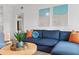 Cozy living room featuring a plush sofa, decorative pillows, and a stylish coffee table, creating a relaxing and inviting space at 341 Wertz Dr, Largo, FL 33771