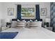 Bright primary bedroom featuring a comfortable bed, matching nightstands, and serene decor at 341 Wertz Dr, Largo, FL 33771