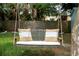 Cozy backyard swing bench featuring pillows and a soft place to relax at 341 Wertz Dr, Largo, FL 33771