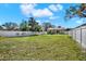Expansive backyard enclosed by a white fence, offering ample space for recreation and relaxation at 3613 21St S Ave, St Petersburg, FL 33711