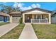 Charming single-story home with a well-manicured lawn and a cozy, inviting front porch at 3613 21St S Ave, St Petersburg, FL 33711