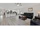 Bright and airy living room with modern bar stool seating and seamless flow into the kitchen area at 3613 21St S Ave, St Petersburg, FL 33711