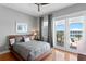 Bright bedroom with gray walls, wood floors, outside views from sliding glass doors at 443 18Th Ave, Indian Rocks Beach, FL 33785