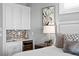Bedroom area with elegant wet bar, mini fridge, and picture window at 443 18Th Ave, Indian Rocks Beach, FL 33785