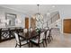 Dining room boasts a modern chandelier and seating for eight at 443 18Th Ave, Indian Rocks Beach, FL 33785
