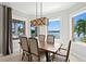 Dining room features water views and seating for six at 443 18Th Ave, Indian Rocks Beach, FL 33785