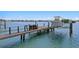 Private boat dock equipped with a boat lift, offering convenient access to the water for nautical adventures at 443 18Th Ave, Indian Rocks Beach, FL 33785
