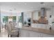 Spacious kitchen with island seating and a view of the water at 443 18Th Ave, Indian Rocks Beach, FL 33785