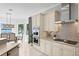 Kitchen featuring stainless steel appliances, and a view of the water and dining room at 443 18Th Ave, Indian Rocks Beach, FL 33785