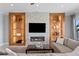 Living room boasts a modern fireplace with stone surround, built-in shelving, and comfortable seating at 443 18Th Ave, Indian Rocks Beach, FL 33785