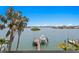Eye-level view of waterfront featuring a boat lift and gorgeous waterfront views at 443 18Th Ave, Indian Rocks Beach, FL 33785