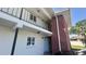Exterior view of a two-story building with a brick facade and a metal balcony railing at 4560 Overlook Ne Dr # 168, St Petersburg, FL 33703