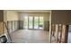Partially renovated living room with access to backyard through sliding glass doors at 4560 Overlook Ne Dr # 168, St Petersburg, FL 33703