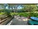 Outdoor patio with seating area overlooking lush landscaping at 4560 Overlook Ne Dr # 168, St Petersburg, FL 33703