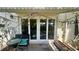 Cozy outdoor patio with seating and sliding glass doors at 4560 Overlook Ne Dr # 168, St Petersburg, FL 33703