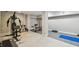 Spacious basement area featuring gym equipment and neutral-colored walls at 48 Bishop Creek Dr, Safety Harbor, FL 34695