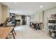Well-organized basement workshop with ample workspace, storage, and tile flooring at 48 Bishop Creek Dr, Safety Harbor, FL 34695