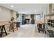 Well-lit basement workshop featuring ample storage, workbenches, and tile flooring at 48 Bishop Creek Dr, Safety Harbor, FL 34695