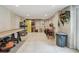 Spacious workshop area in basement with ample workspace, storage, and tile flooring at 48 Bishop Creek Dr, Safety Harbor, FL 34695