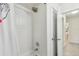 Clean bathroom showcasing shower/tub with a white tiled surround, modern fixtures, and natural light at 48 Bishop Creek Dr, Safety Harbor, FL 34695
