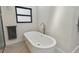 Modern bathroom featuring a freestanding tub, stylish fixtures, and a sleek, contemporary design at 48 Bishop Creek Dr, Safety Harbor, FL 34695