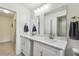 Bathroom showcasing double sinks, quartz countertop, and modern fixtures offers style and functionality at 48 Bishop Creek Dr, Safety Harbor, FL 34695