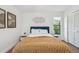 Charming bedroom features a comfortable bed, wood floors, and tasteful decor for a relaxing retreat at 48 Bishop Creek Dr, Safety Harbor, FL 34695